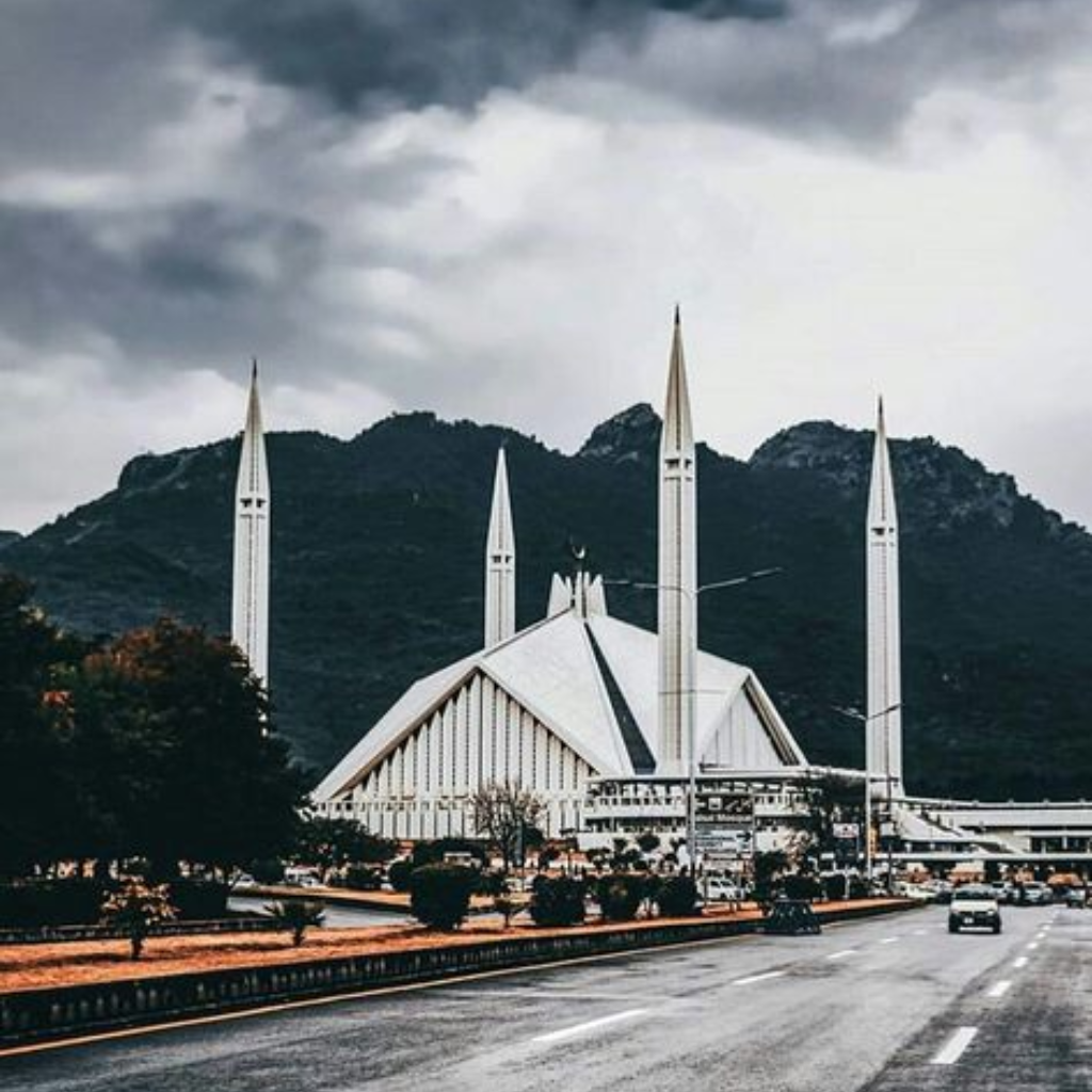 Islamabad city view with Faisal Mosque, green hills, and modern urban landscape